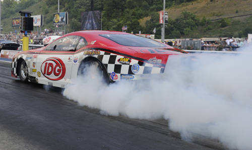 Driving his nitrous-injected Camaro, wiley veteran Rickie Smith rolled to victory in Pro Mod racing.